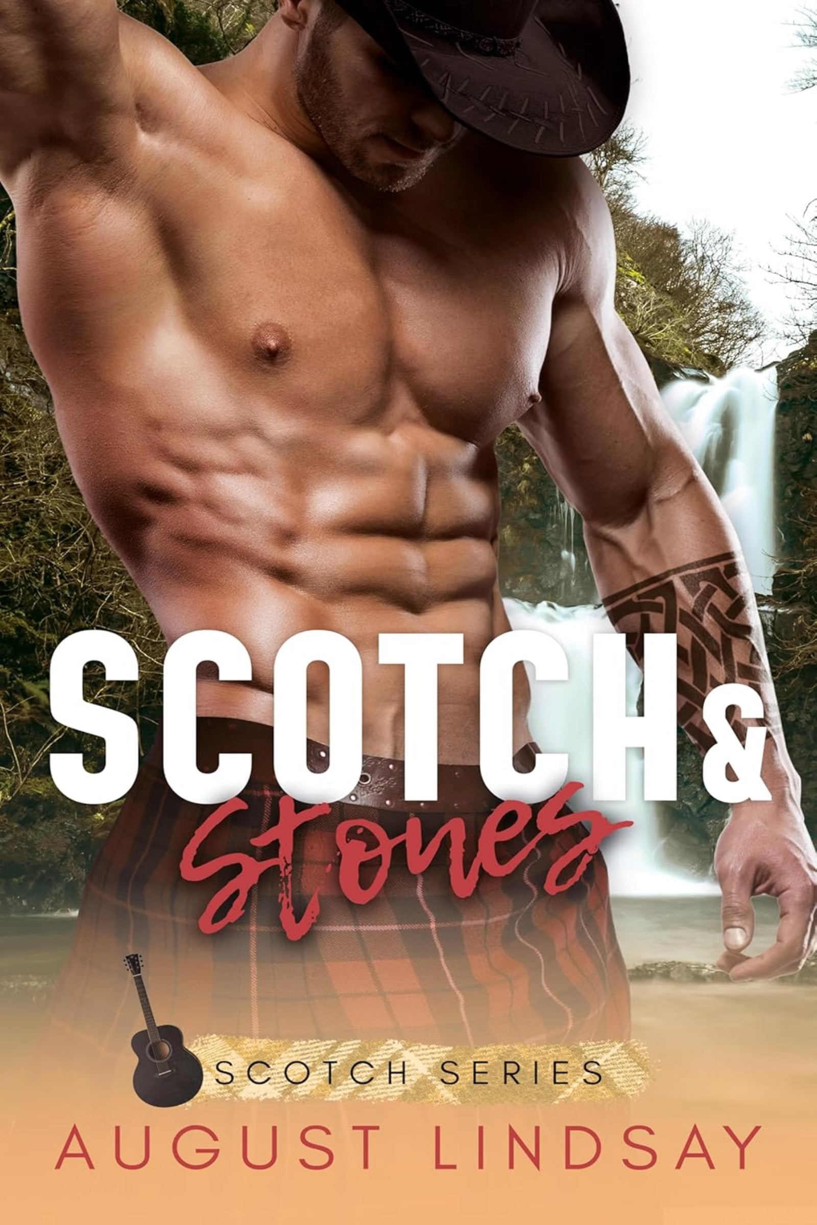 Book cover of 'Scotch & Stones' by August Lindsay featuring a shirtless man with tattoos against a waterfall background.